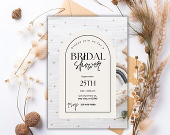 May include: Bridal shower invitation with an arch design. The invitation features the text "Please join us for a Bridal Shower" and event details. The background has a subtle star pattern. Dried flowers and decorative elements surround the invitation.