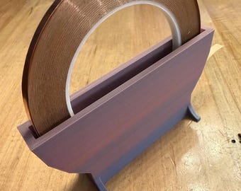 Stained glass foil holder, copper foil holder, copper tape holder. Single roll, up to 3/8” width. Many colors available.  5”x2-1/2”x1-1/2”.