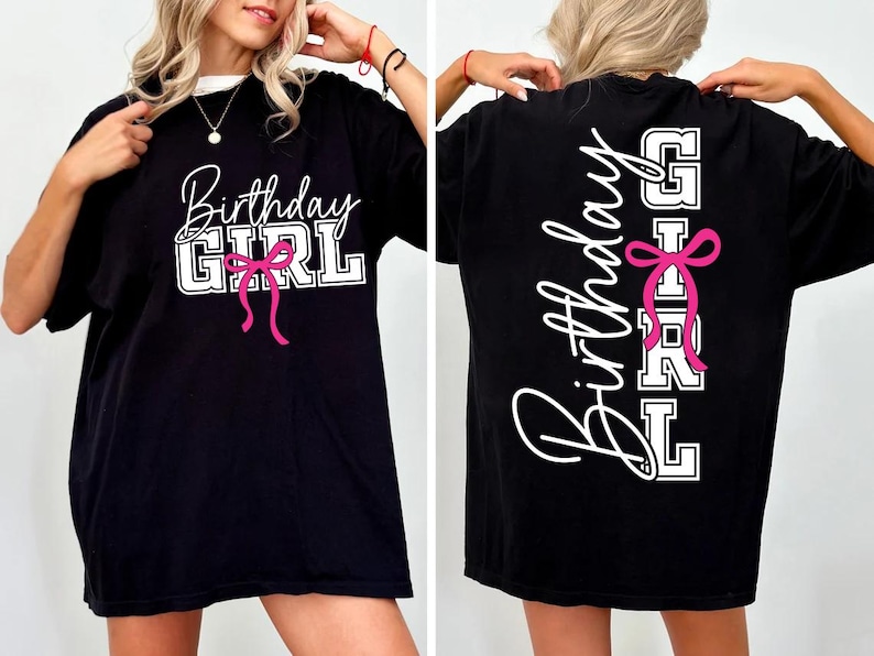 May include: Black t-shirt with the text "Birthday Girl" in white script and block letters, accented with a pink bow. The back of the shirt also features the text "Birthday Girl" in a vertical design with a pink bow.