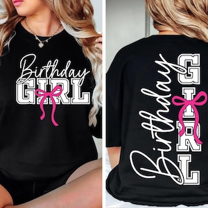 May include: Black sweatshirt with the words "Birthday Girl" in white script and block letters, accented with a pink bow. The back of the shirt also features the words "Birthday Girl" in white script and block letters, with a pink bow.