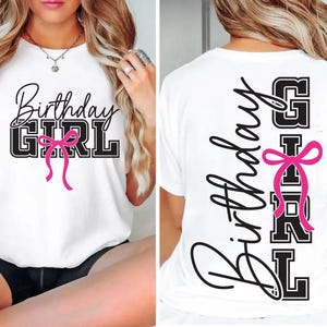 May include: White t-shirt with the text "Birthday GIRL" in black and a pink bow graphic. The design is on the front and back of the shirt. The front design has the words stacked, and the back design has the words vertically.