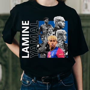 May include: Black t-shirt with a collage of images of a footballer, with the name "LAMINE YAMAL" printed vertically in white. The collage includes images of the player in various poses and team kits.