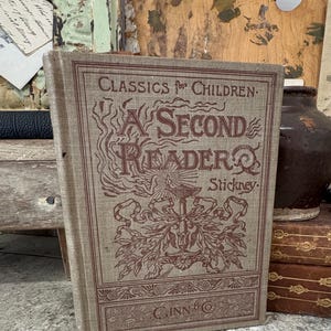 May include: A set of three ceramic mugs with a speckled, matte finish. The mugs are in shades of cream, light gray, and dark gray. Each mug has a simple, minimalist design, perfect for coffee or tea.