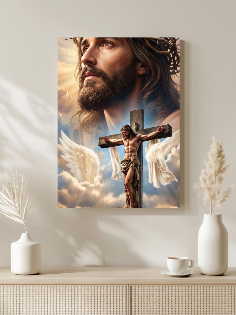 May include: A rectangular wall art print featuring a large, detailed portrait of a bearded figure wearing a crown of thorns, positioned above a smaller depiction of the same figure on a wooden cross, surrounded by white wings and clouds.