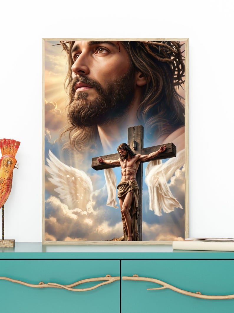 May include: A framed wall art print featuring a large, detailed portrait of Jesus wearing a crown of thorns, positioned above a smaller depiction of Jesus on a wooden cross with white fabric draped over the arms, set against a cloudy sky.