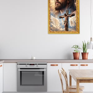May include: A rectangular wall art piece featuring a portrait of Jesus Christ above a depiction of the crucifixion with white wings against a cloudy sky, all enclosed within an ornate, textured gold-colored frame with intricate carved details.