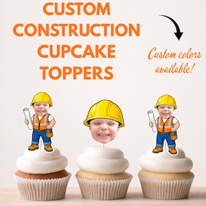 May include: Three cupcakes topped with custom construction-themed decorations. Two toppers feature a cartoon construction worker body with a child's face wearing a yellow hard hat, holding blueprints. One topper shows a child's face in a yellow hard hat.