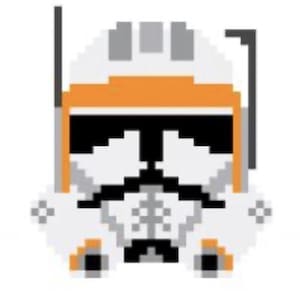 May include: Pixelated illustration of a white and orange helmet. The helmet features a black visor and gray accents on the top. The design is reminiscent of a clone trooper helmet from a science fiction franchise.