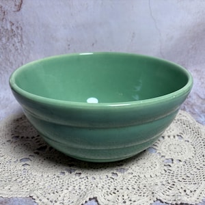 May include: A set of three ceramic mugs with a speckled, matte finish. The mugs are in shades of cream, light gray, and dark gray. Each mug has a simple, minimalist design, perfect for coffee or tea.