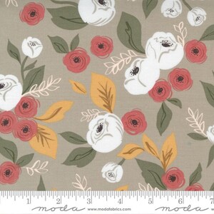 May include: Floral fabric with a repeating pattern of white and coral roses, yellow and green leaves, and delicate white sprigs on a tan background. The fabric has a soft, muted color palette and a vintage aesthetic.