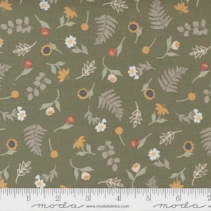 May include: Olive green fabric with a repeating pattern of stylized flowers and leaves in shades of yellow, white, and red. The fabric includes a ruler along the bottom edge.
