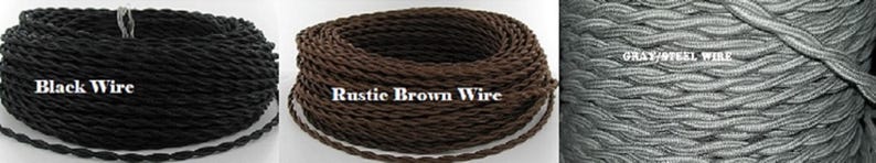 May include: Three spools of decorative wire in black, rustic brown, and grey-steel colours. The black wire spool has the text "Black Wire". The rustic brown wire spool has the text "Rustic Brown Wire". The grey-steel wire spool has the text "GRAY/STEEL WIRE".
