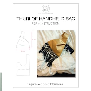 May include: A digital sewing pattern for the Thurloe Handheld Bag, featuring a gold fabric bag with black fringe trim. The document includes a technical line drawing with dimensions of 37 cm by 24 cm, a single pattern piece diagram, and instructions.