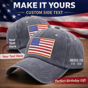 May include: Two grey baseball caps featuring an embroidered American flag patch. The caps display the text "MAKE IT YOURS" and "CUSTOM SIDE TEXT". One cap has "Your Text Here" and the other has "AMERICA 250 1776-2026".