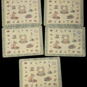 May include: Set of five square placemats with a garden theme. Each placemat features a light beige background with a repeating pattern of garden elements, including a wooden archway, birdhouse, and various gardening tools. The border is a muted green.