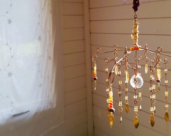 Crystal Suncatcher Chandelier for New Apartment or Dorm Room: A Must-Have Housewarming Gift for a Sparkling Space