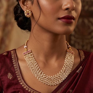 May include: A set of three ceramic mugs with a speckled, matte finish. The mugs are in shades of cream, light brown, and dark brown. Each mug has a simple, minimalist design, perfect for coffee or tea.