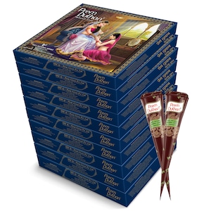 May include: A stack of blue boxes of Prem Dulhan Mehndi Cone. The top box features an illustration of two women in traditional Indian attire. Two henna cones are in front of the boxes.