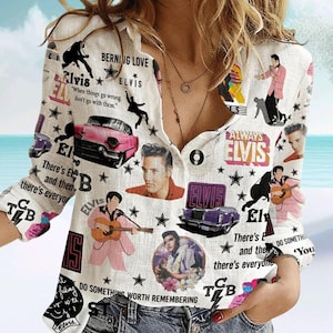 May include: White button-down shirt featuring Elvis Presley imagery. The shirt is covered with images of Elvis, classic cars, stars, and text including "Burning Love" and "Always Elvis". The long-sleeved shirt has a relaxed fit.