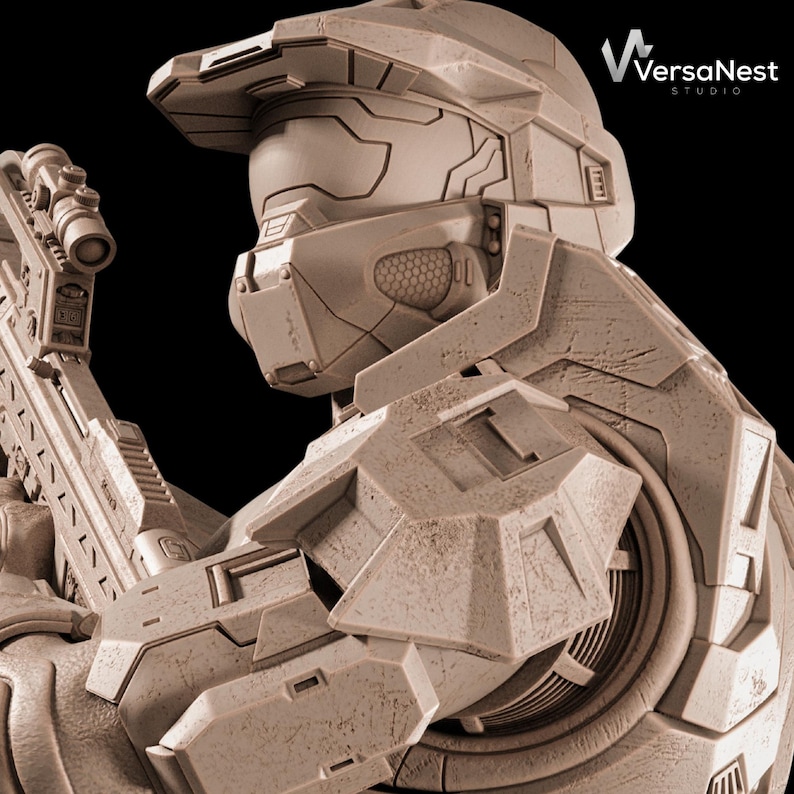 May include: A detailed, weathered, beige-colored sculpture of a futuristic soldier's helmet and armor, holding a rifle. The sculpture has intricate details and textures, with the VersaNest Studio logo in the upper right corner.