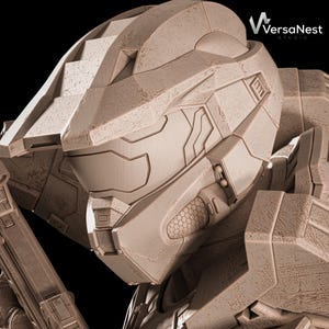 May include: Close-up of a detailed, weathered, tan-colored helmet, likely from a science fiction or video game context. The helmet features angular designs, a visor, and intricate paneling. The VersaNest Studio logo is visible in the upper right corner.