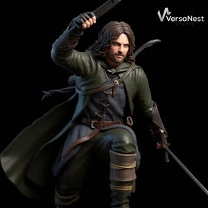 May include: A detailed figurine of a character from The Lord of the Rings, dressed in a green cloak and tunic, holding a sword and a knife. The figure has long brown hair and a determined expression. The VersaNest Studio logo is in the top right corner.