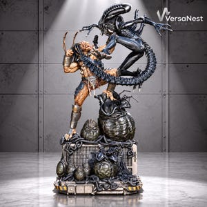 Puede incluir: Una estatua detallada de resina que representa una batalla entre una figura Predator de color bronce con armadura y una criatura Alien negra biomecánica. Las figuras se alzan sobre una base con huevos oscuros y estructuras de cables.