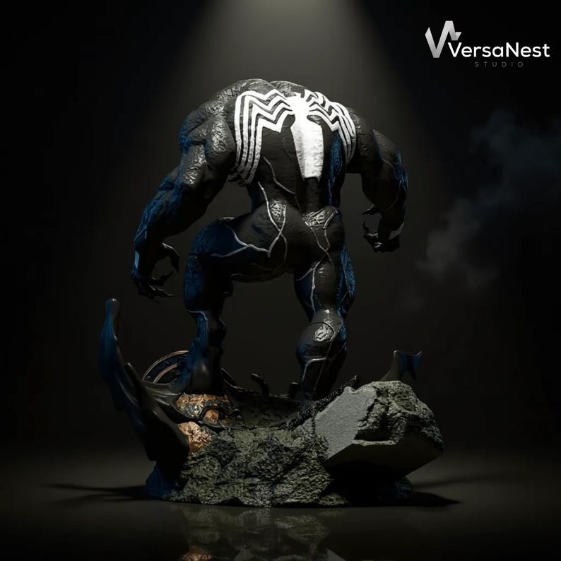 May include: A black and white Venom statue, showcasing the character's muscular physique and iconic spider emblem on the back. The statue is posed on a detailed, rocky base, with the VersaNest Studio logo visible.