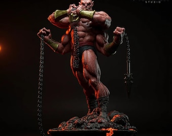 May include: A detailed statue of a muscular, four-armed humanoid figure with red skin, wearing black briefs and gold armbands. The figure holds a chain and a bladed weapon. The statue is on a rocky base, with the VersaNest Studio logo in the background.