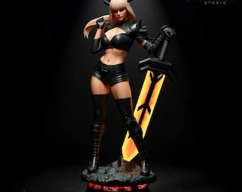 May include: A detailed figurine of a female character in a black outfit, holding a glowing sword. The figure has blonde hair and is posed on a rocky base. The background is dark, with the VersaNest Studio logo visible.