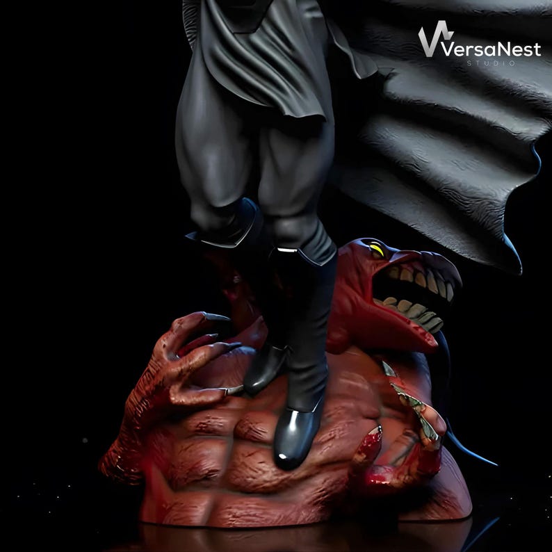 May include: A detailed statue featuring a figure in black attire standing on a red, monstrous creature. The statue has a dark aesthetic, with the figure's boots and the creature's features clearly defined. The VersaNest Studio logo is visible in the background.