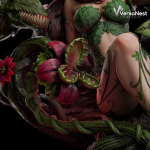 May include: A detailed sculpture of a character with green and red plant-like features. The figure is adorned with leaves and vines, with a large, open-mouthed flower in the foreground. The sculpture has a dark, detailed background.