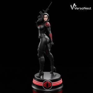 May include: A black figurine of a woman in a black bodysuit, holding a rifle. She wears glasses and has red accents on her shoulders and arms. The figurine stands on a round base with a red illuminated design and a Cobra logo.