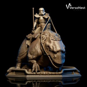 May include: A detailed sculpture of a Stormtrooper riding a dinosaur-like creature. The figure is in a seated position, holding a staff. The sculpture is a bronze color and sits on a rectangular base. The VersaNest Studio logo is in the upper right corner.