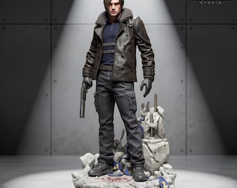 May include: A detailed collectible figurine of a male character with brown hair, wearing a dark brown leather jacket with a fur collar, a navy blue shirt, and dark grey cargo trousers. The figure holds a handgun and stands on a rocky base with debris.
