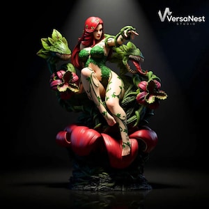 May include: A detailed statue of a woman with red hair and green ivy-like attire, seated amidst large red and green plant life. The statue has a dark background with the VersaNest Studio logo in the upper right corner.