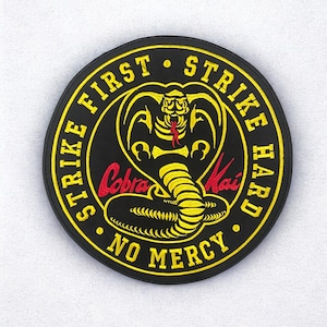 Bold Cobra Kai iron-on patch with &#39;Strike First, Strike Hard, No Mercy&#39; design  Perfect for jackets, vests, or bags-Available multiple sizes