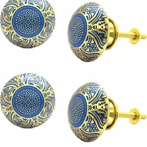 May include: Four decorative cabinet knobs. Each knob features a blue center with a dotted pattern, surrounded by gold filigree designs. The knobs have a gold-colored stem and are set against a white background.