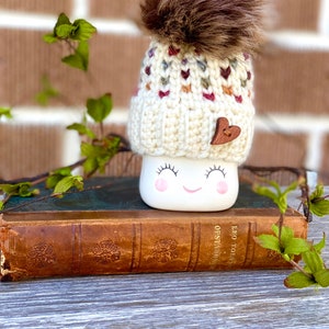 Fall in love with this cute Marshmallow Mug hat. Autumn colored hearts!