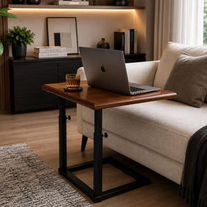 May include: A height-adjustable side table with a rectangular wooden top and a black metal frame. The table features two vertical support posts with visible adjustment knobs, a flat base, and a smooth, polished finish on the wooden surface.
