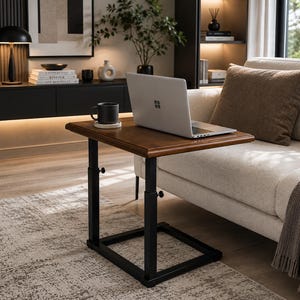 May include: A rectangular wooden side table with a dark brown finish and a black metal frame. The table features an adjustable height mechanism with visible knobs on the vertical supports. A silver laptop and a black mug are placed on the surface.