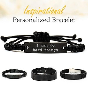 May include: Black personalized bracelets with the text "I can do hard things." The image shows three different bracelet styles: a braided leather, a mesh band, and a silicone band. The top bracelet has a woven cord.