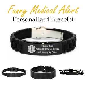 以下が含まれることがあります： 「If Found Dead Delete My Browser History and Destroy My Phone」のテキストが入った黒い医療アラートブレスレット。ブレスレットには医療シンボルがあり、他の3つの黒いブレスレットと一緒に表示されています。