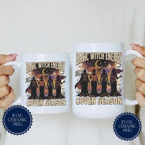 May include: Two white ceramic mugs, one 11 oz and one 15 oz, featuring a graphic of four figures in long dresses under a crescent moon. The text reads BASIC WITCH ENERGY and COVEN SEASON. The design includes stars, bats, and trees in a dark color palette.