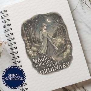 May include: A spiral notebook featuring a printed illustration of a person in a long dress walking through a forest at night with a crescent moon, stars, and glowing mushrooms. The text reads, "MAGIC IS HIDING IN THE ORDINARY" in capital letters.