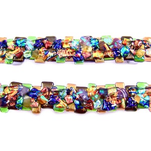 May include: Two rectangular, decorative glass barrettes. Each barrette features a mosaic of colorful glass pieces in shades of blue, green, gold, and red. The barrettes are set against a white background.