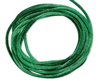 May include: A spool of green waxed cord, perfect for jewelry making or crafts.