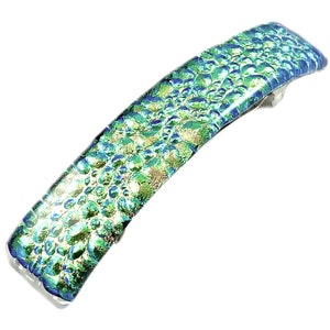 May include: A shimmering, iridescent hair barrette with a textured, scale-like pattern. The barrette features shades of green, blue, and gold, and is made of glass. The metal clasp is silver. This accessory is perfect for adding a touch of elegance.