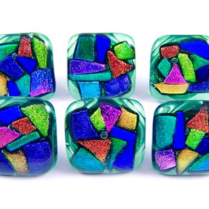 May include: Six square glass decorative buttons with a mosaic design. Each button features a clear, light green border and a colorful interior of blue, green, red, purple, and gold glass pieces. The buttons are arranged on a white background.