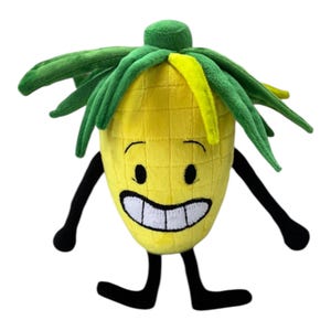 May include: A plush toy shaped like a yellow corn cob with a grid pattern. It features green fabric leaves at the top, one yellow leaf, and a wide, smiling face with black eyes and a white mouth. The toy has thin black arms and legs.